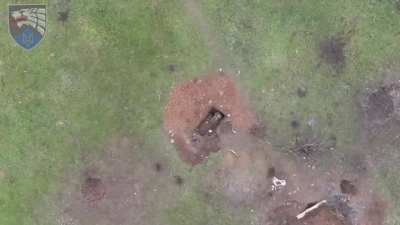 Ukrainian drone drops a grenade on a Russian soldier.