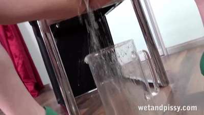 Sexy redhead Miss Olivia catches her golden piss