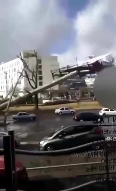 Old Advertisement Board Falls into Traffic in Mexico