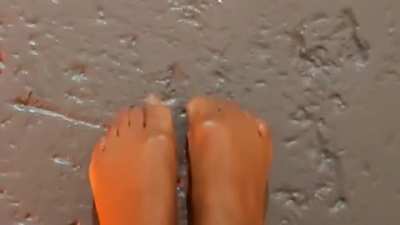 Glossy legs, shiny feet and glittery toes.