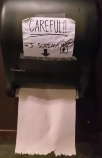 Possessed toilet paper dispenser