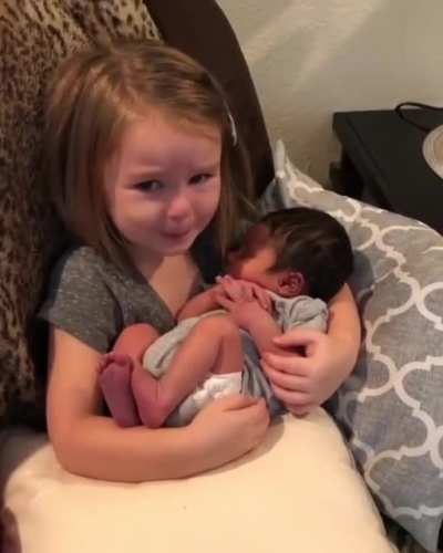 Holding the baby for the first time.