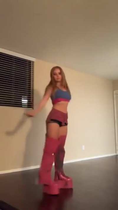 Showing off her slutty costume and ass