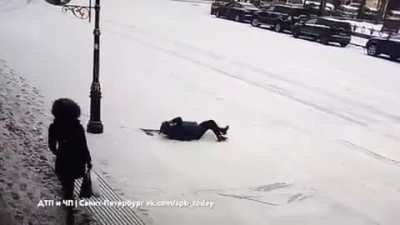 A woman slipped on the ice. Let's rush to help her