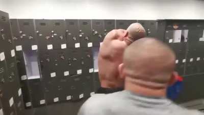 Bodybuilder can’t reach the sticker on his back