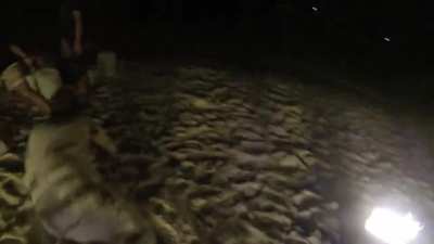 Jumping through a ring of fire in Thailand