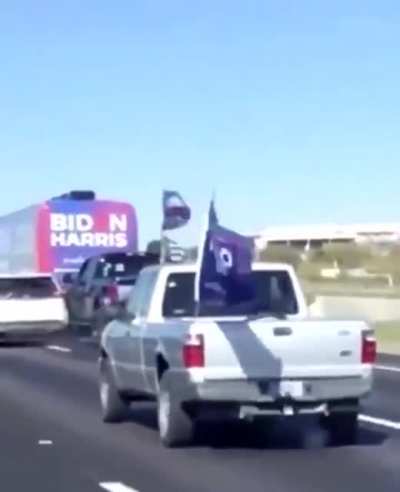 Trump supporters ram into Biden campaign staff in an act of domestic terror.