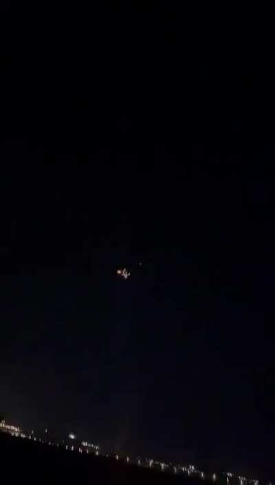Missile barrage from Lebanon + Iron Dome interceptor launch captured in the same clip