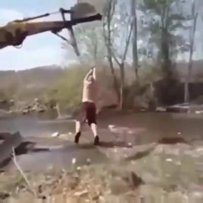 Idiot almost gets thrown off a cliff
