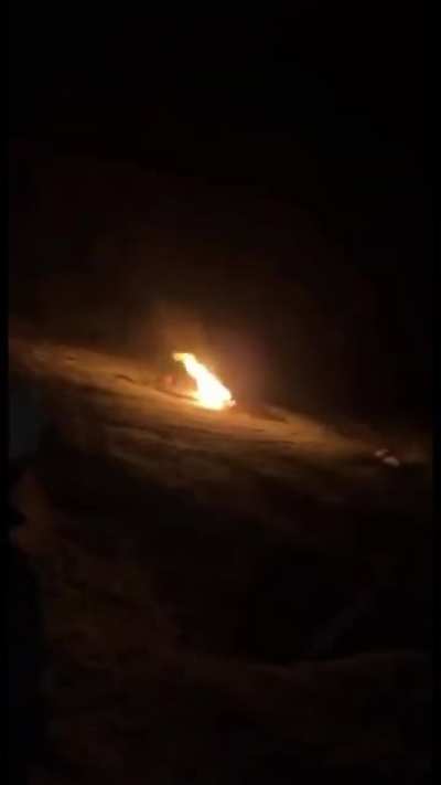 A propane tank flying through the night.