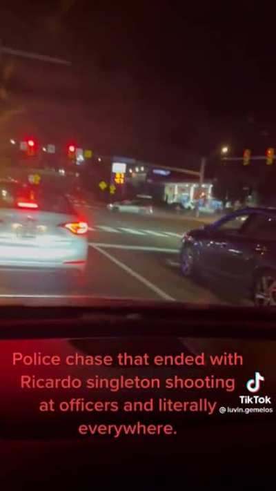 Guy being pursued by police gets out of car and shoots at them