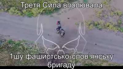 Two Russian soldiers instantly killed by a direct artillery hit while walking down the road.