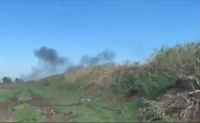 Ukrainian soldiers capturing and transporting POW in humvee while artillery landing in the background. Kherson - October 2022