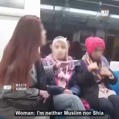 Iranian woman not wearing a hijab is harrassed by a supporter of Iran's regime and bystanders come to the woman's defence against the harrassment.