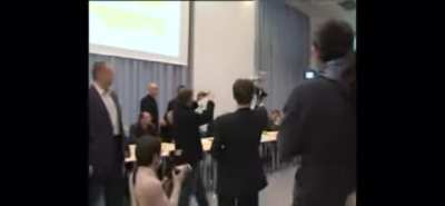 Remote-controlled dildo helicopter at a press conference