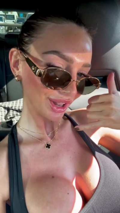 Maddy's show's off her enormous silicone jugs in a car