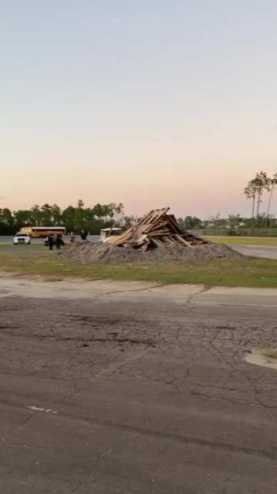 Lighting a boring bonfire for a school event. Walks out like nothing happened