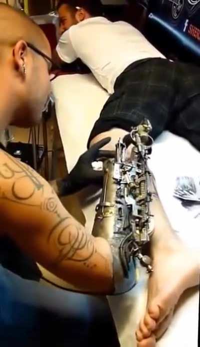 This tattoo artist turned their prosthetic limb into a tattoo gun