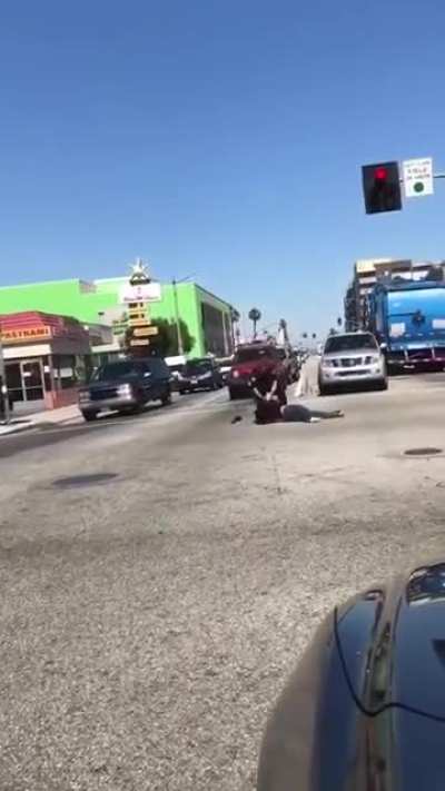Karen blocks traffic and tries to fight a cop before getting tackled and arrested