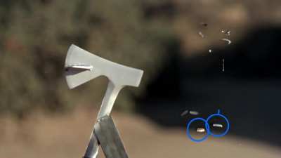 A bullet hitting an axe and being split into eight pieces