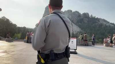 Antivax flat earther talking nonsense on a microphone gets arrested at Mount Rushmore