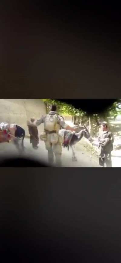 US soldier harassing Afghani kids & pointing his gun at them as a joke