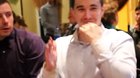 This man in a restaurant with his finger dancing
