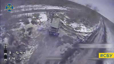 A Ukrainian Kamikaze Drone hits a Russian TOS-1 that is firing rockets