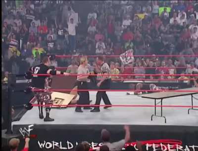 Mike Chioda punches Charles Robinson in the face to stop him from naming Bubba Ray & D-Von Dudley the co-WCW World Heavyweight Champion.