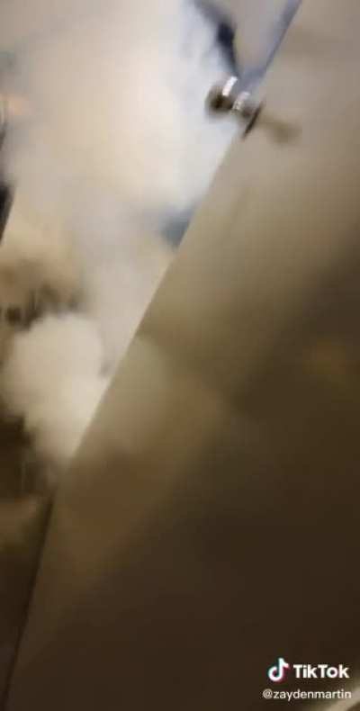 Battery explodes while guy smashes phone