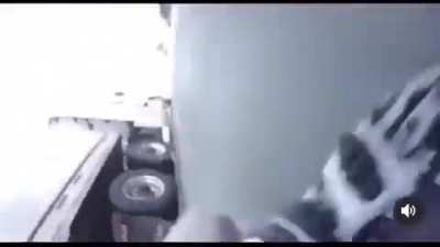 Sliding under a moving truck