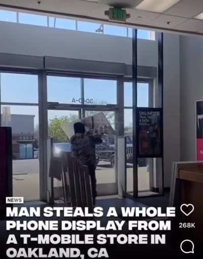 Man steals the entire display at phone store.