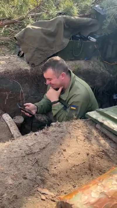 “East. The little things move you to tears here. The paratrooper against the background of shelling watches the Easter greeting of the President. It's great to see these Titans cheering.”