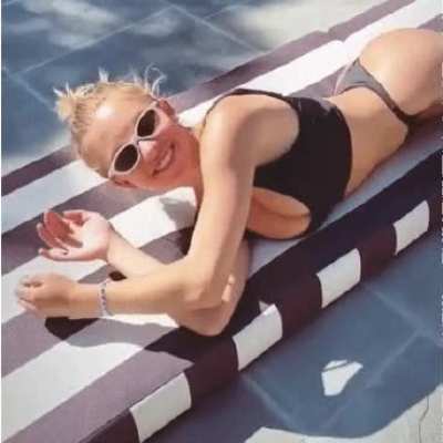 Cutie Sydney Sweeney rolling over to get a better look of my cock.