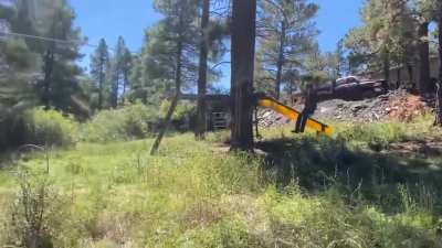 Redneck Engineering a homemade zipline. I believe he just about has it dialed in...