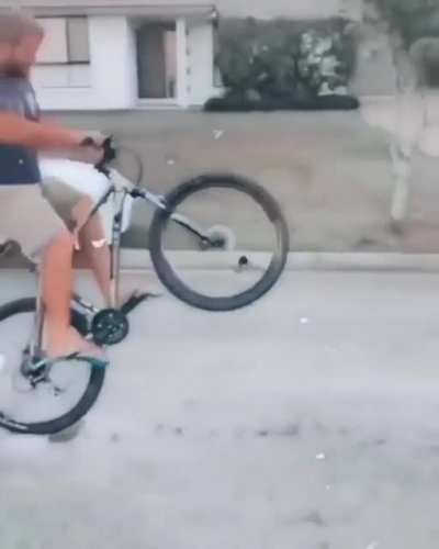 The man falls give his bicycle