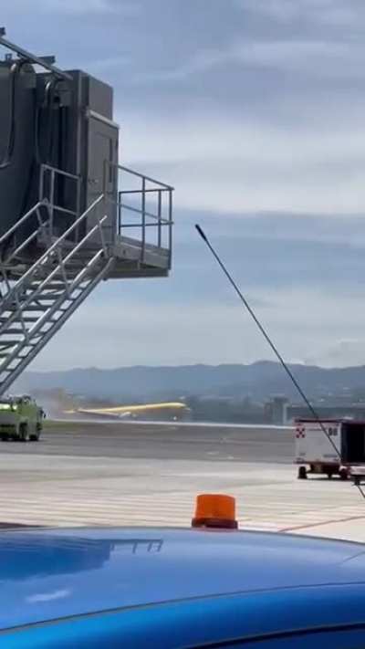 DHL Boeing 757 cargo jet breaking into two after skidding off the runway