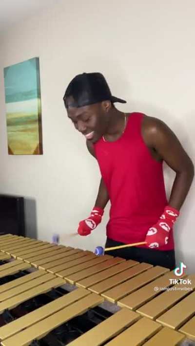 Man plays the Mario theme song on the xylophone while beatboxing
