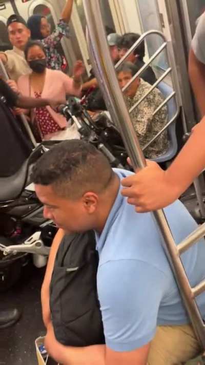 Dude bring his motorcycle onto the subway then get mad when people try to pass by