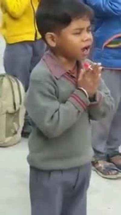 Sucking lollipop discreetly during morning prayer