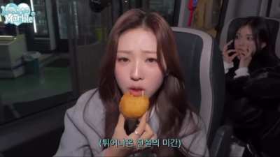 Stella, Ian, Yuha, Ye-on, & Juun eating street food