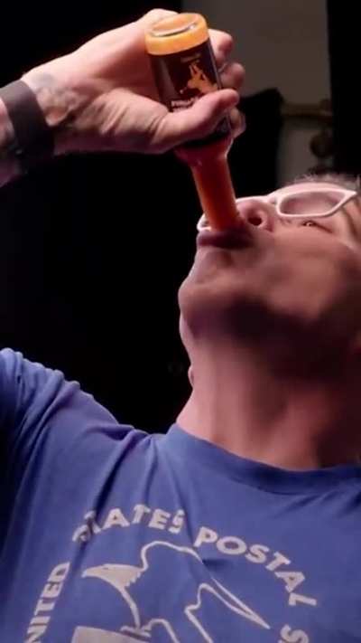 Steve O drinks a bottle of hot sauce