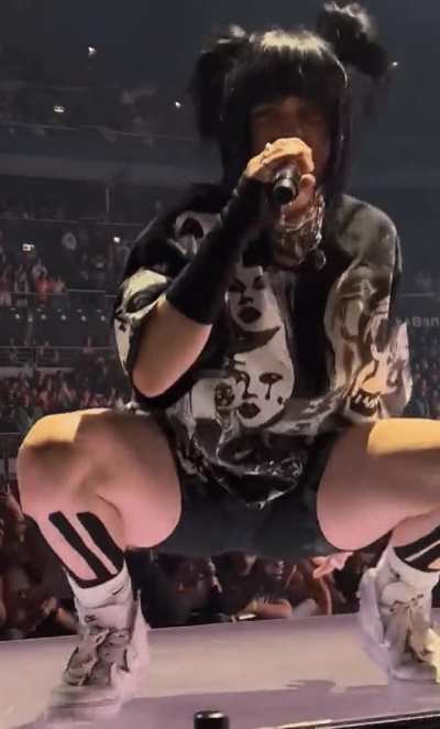Slowed down leg spread bounce on stage