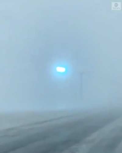 Cellphone footage shows power lines flashing as blizzard sweeps through Minnesota