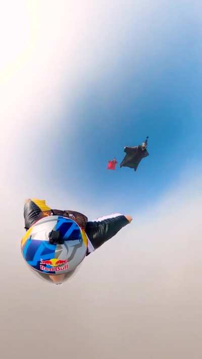 Wingsuit flying next to the pyramids