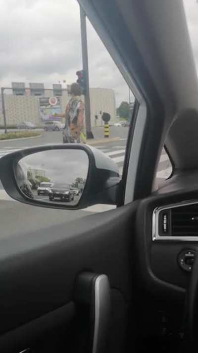 Dude is having the time of his life, in the middle of the road