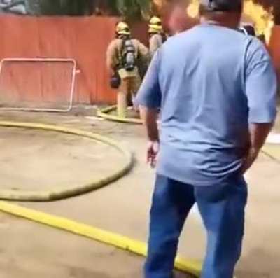 Dad runs into a burning building to save the family dog