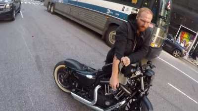 Trying to show off with no helmet on an expensive Harley in NYC streets