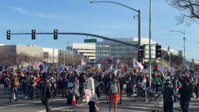Anti-ICE protesters gather near Levi's Stadium during Super Bowl LX