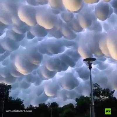 A captivating and unusual meteorological phenomenon, known as Mammatus clouds, recently graced the skies of China's Hubei province